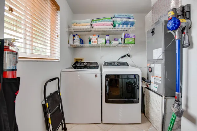 a utility room with dryer and washer