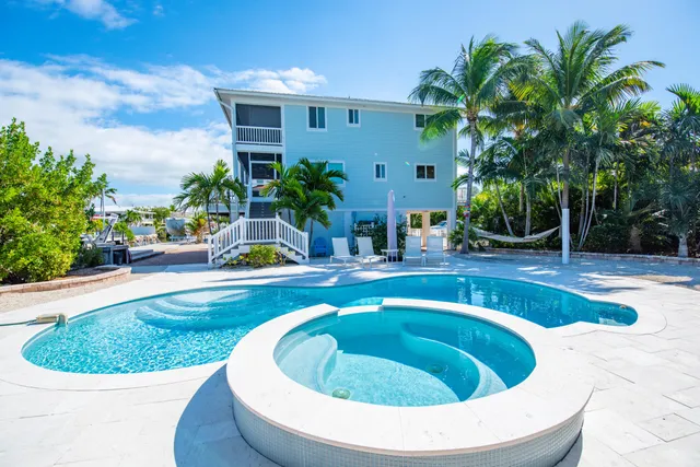 a view of a back yard of a house