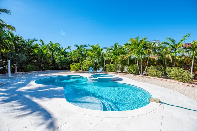 a view of a house with a deck and a patio
