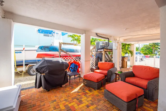 a view of a chairs on wooden deck