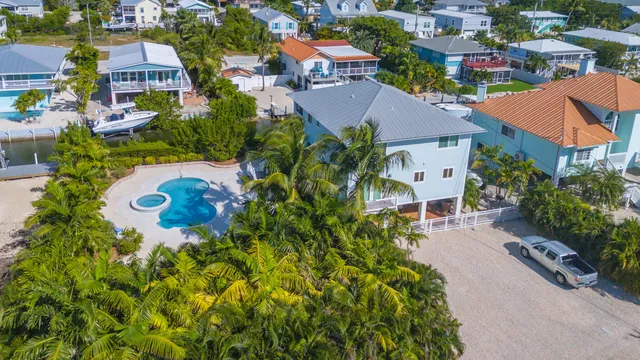 a view of a swimming pool in he middle of the house