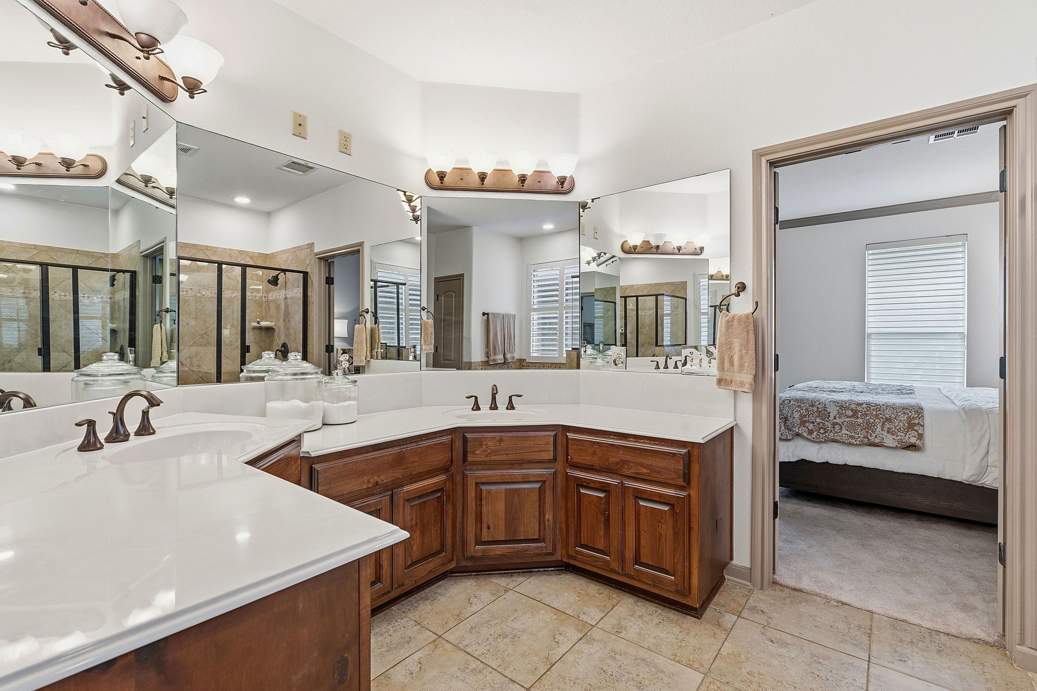 12321 Edenvale Path Austin, TX 78732 - Photo 17 of 36 Double vanities and ample counter space create a functional and spacious bathroom.