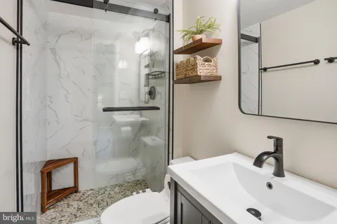a bathroom with a sink and toilet