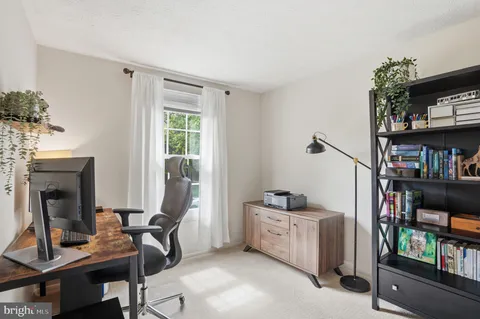 a view of a workspace with furniture and toys