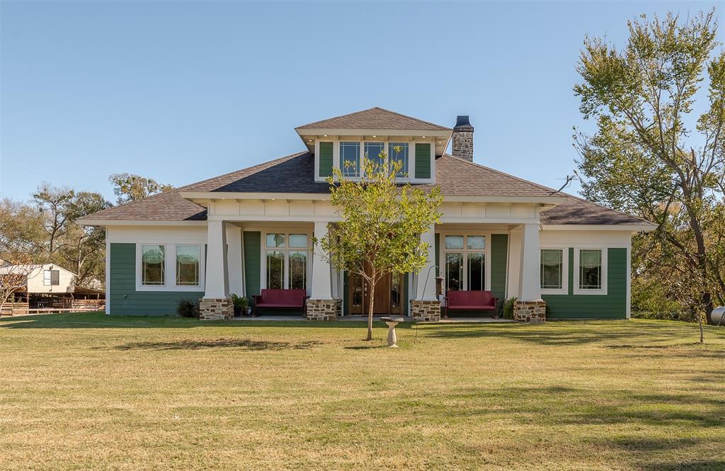 1342 Highway 14 Kosse, TX 76653 - Photo 1 of 49 a front view of a house with swimming pool and porch