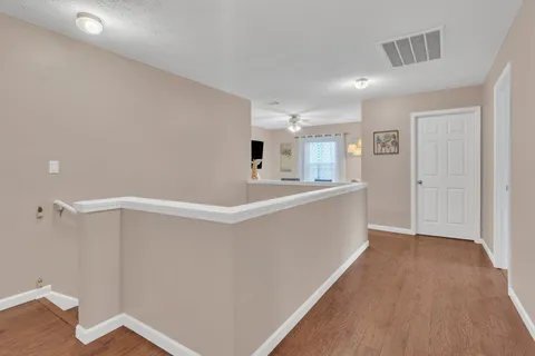 a view of kitchen with center island and hallway