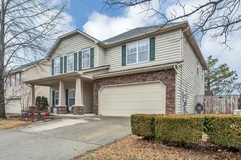 a front view of a house with a garage