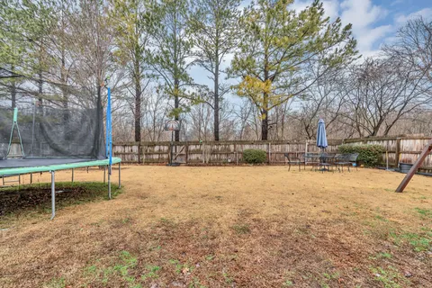 a swimming pool with wooden fence