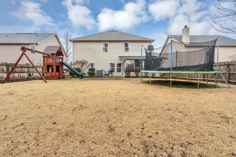 a view of a house with a park