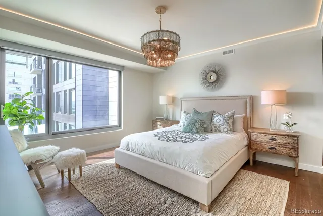 a bedroom with a large bed and a window