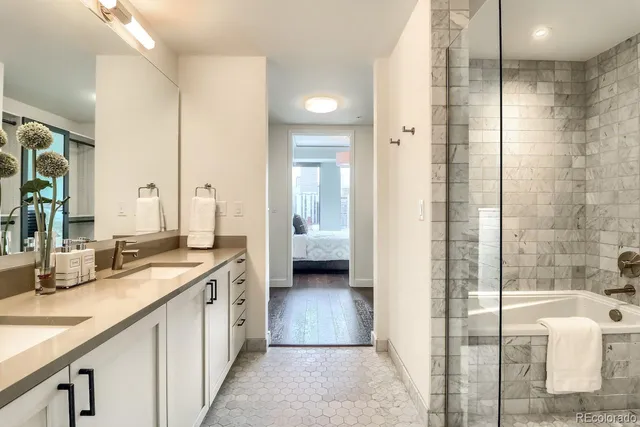 a bedroom with a bed window and a desk