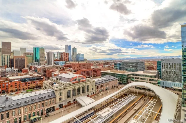 a large kitchen with kitchen island granite countertop a sink and a stove top oven