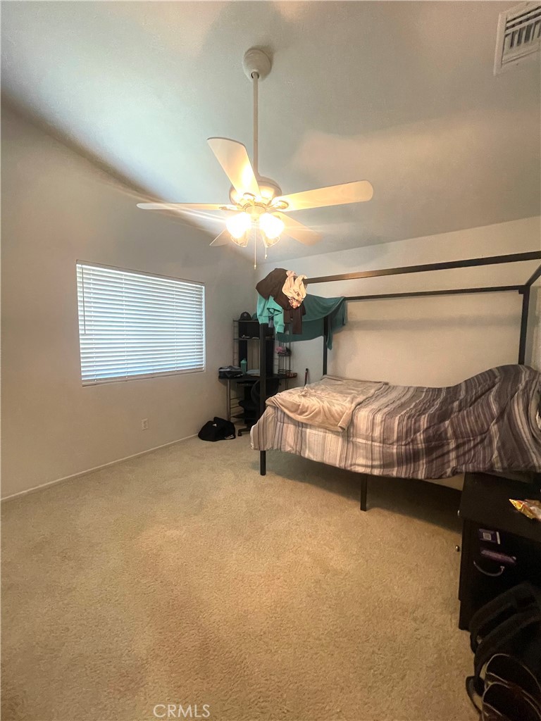 965 Hardwick Avenue Beaumont, CA 92223 - Photo 13 of 19 a bedroom with a bed and window