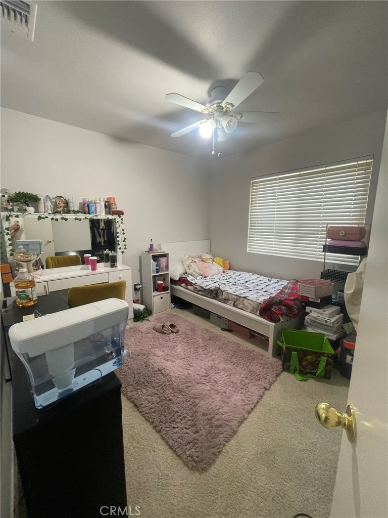 965 Hardwick Avenue Beaumont, CA 92223 - Photo 14 of 19 a kitchen with a stove a sink and a refrigerator