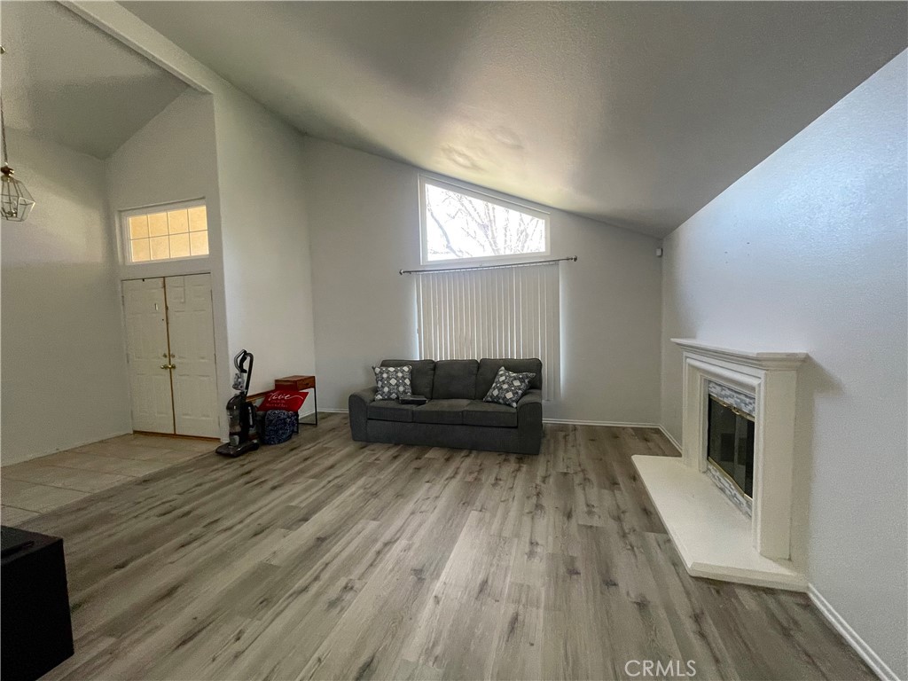 965 Hardwick Avenue Beaumont, CA 92223 - Photo 3 of 19 a living room with furniture and a fireplace