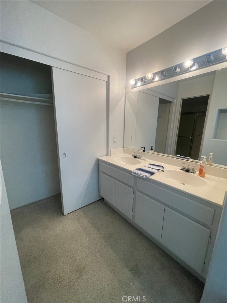 965 Hardwick Avenue Beaumont, CA 92223 - Photo 10 of 19 a bathroom with a double vanity sink mirror and bathtub