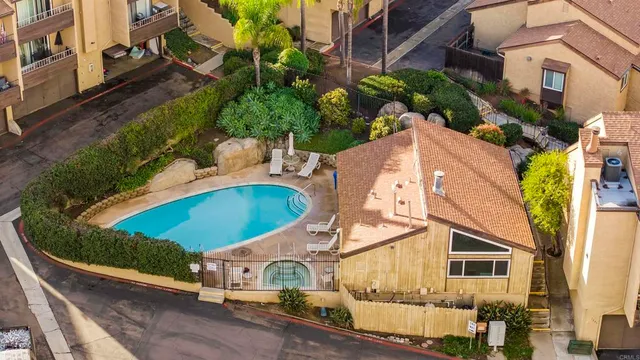 an aerial view of houses with outdoor space