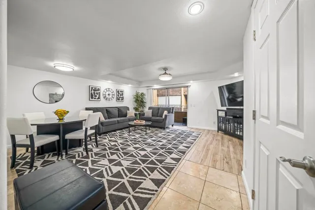 a kitchen with a stove a sink and a refrigerator