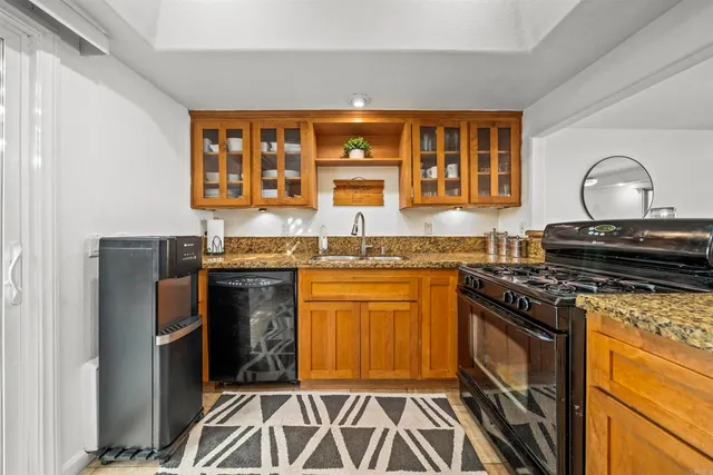 a white toilet sitting next to a shower