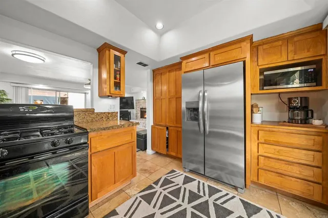 a living room with furniture a flat screen tv and a table