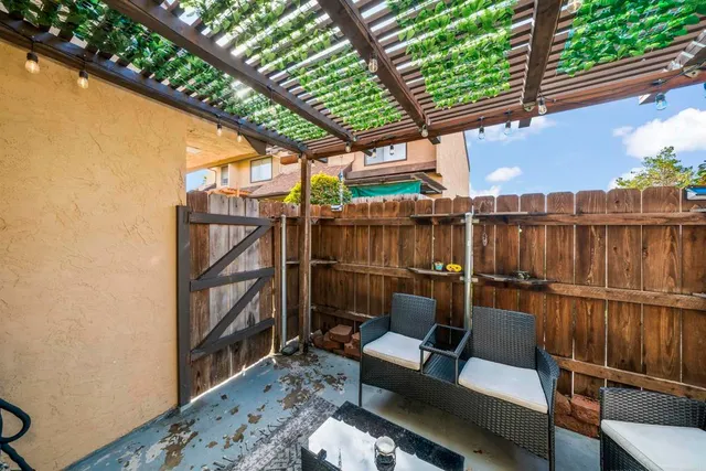 a living room with furniture a dining table and a fireplace