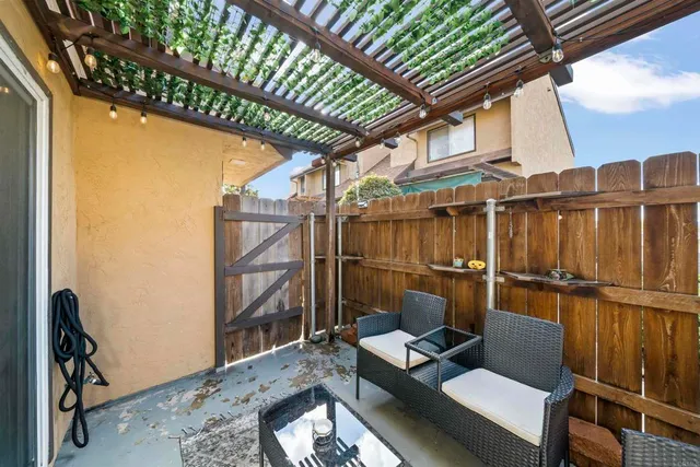 a view of balcony with floor to ceiling windows with wooden floor