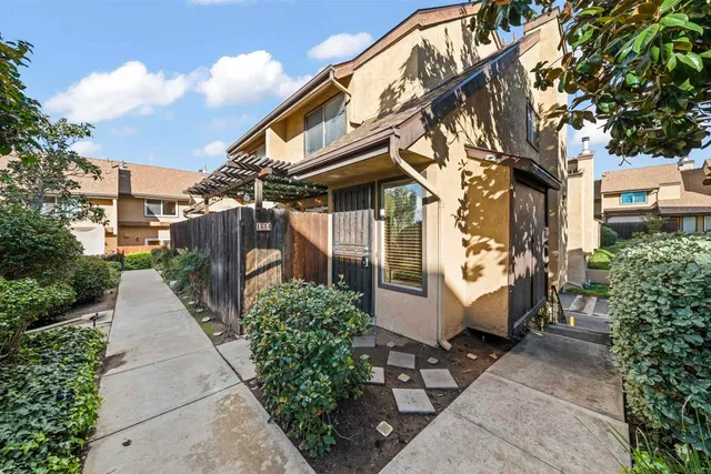 a view of a patio with a table and chairs