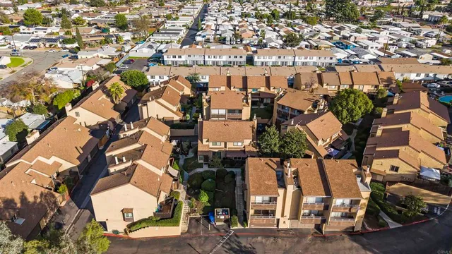 an aerial view of a house with a yard