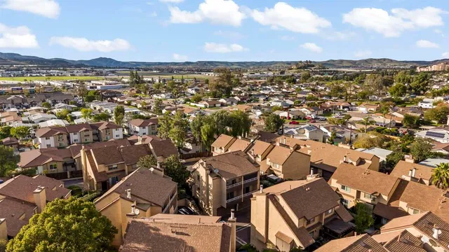 an aerial view of a house with a swimming pool