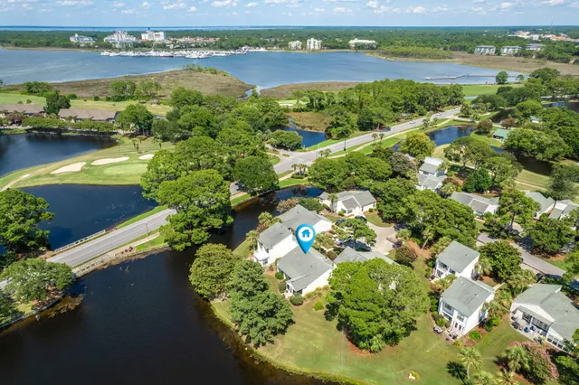 an aerial view of a houses with outdoor space and lake view