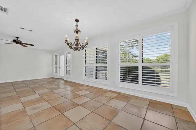 a kitchen with stainless steel appliances granite countertop a sink and a stove