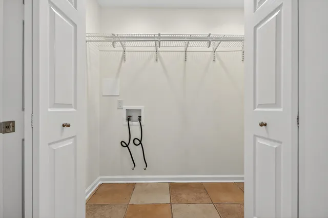 an aerial view of a houses with a lake view