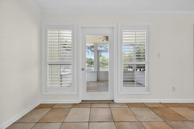 an aerial view of a house with a lake view