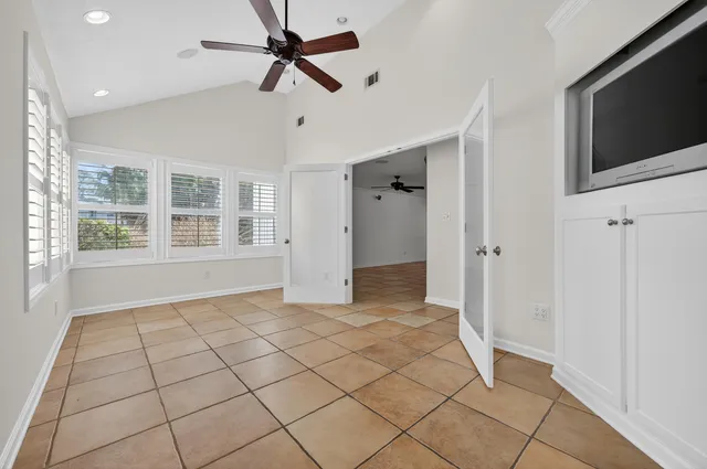 a view of a kitchen with a sink and cabinets