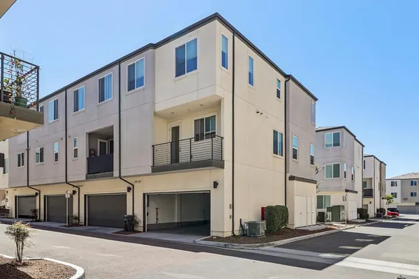 a front view of a building with a street