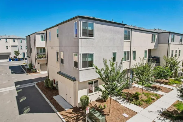 a front view of a house with outdoor seating