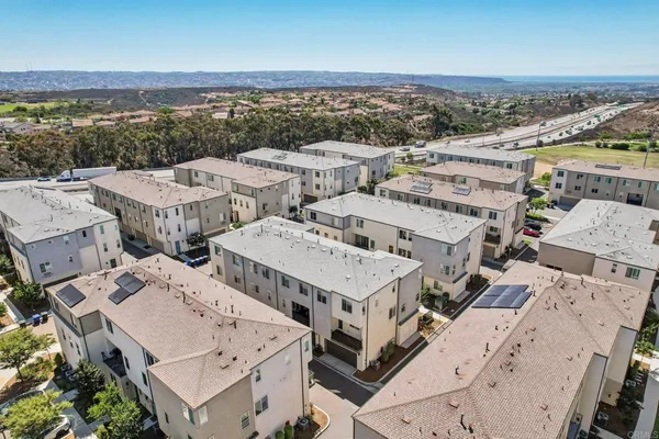an aerial view of a city with lots of residential buildings