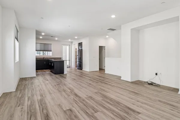 a view of kitchen and refrigerator