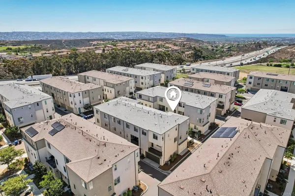 an aerial view of a city with lots of residential buildings