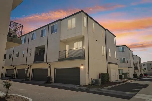 a front view of a building with a road