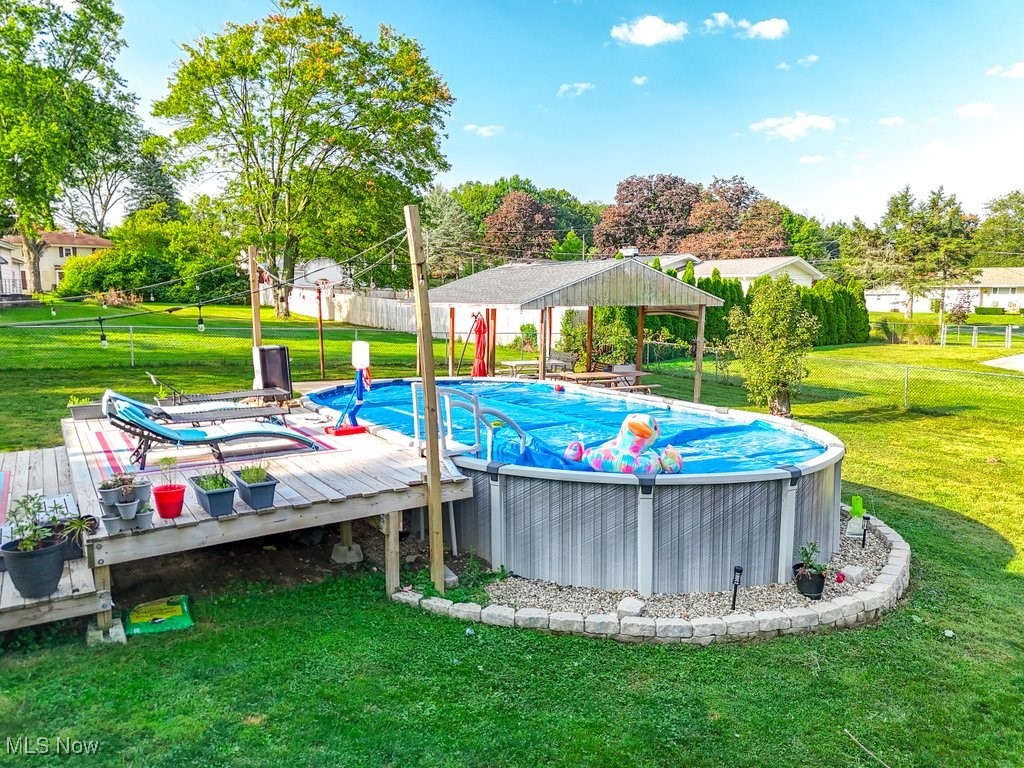 3066 Prior Road Akron, OH 44319 - Photo 36 of 50 View of pool with a lawn, a wooden deck, and a gazebo