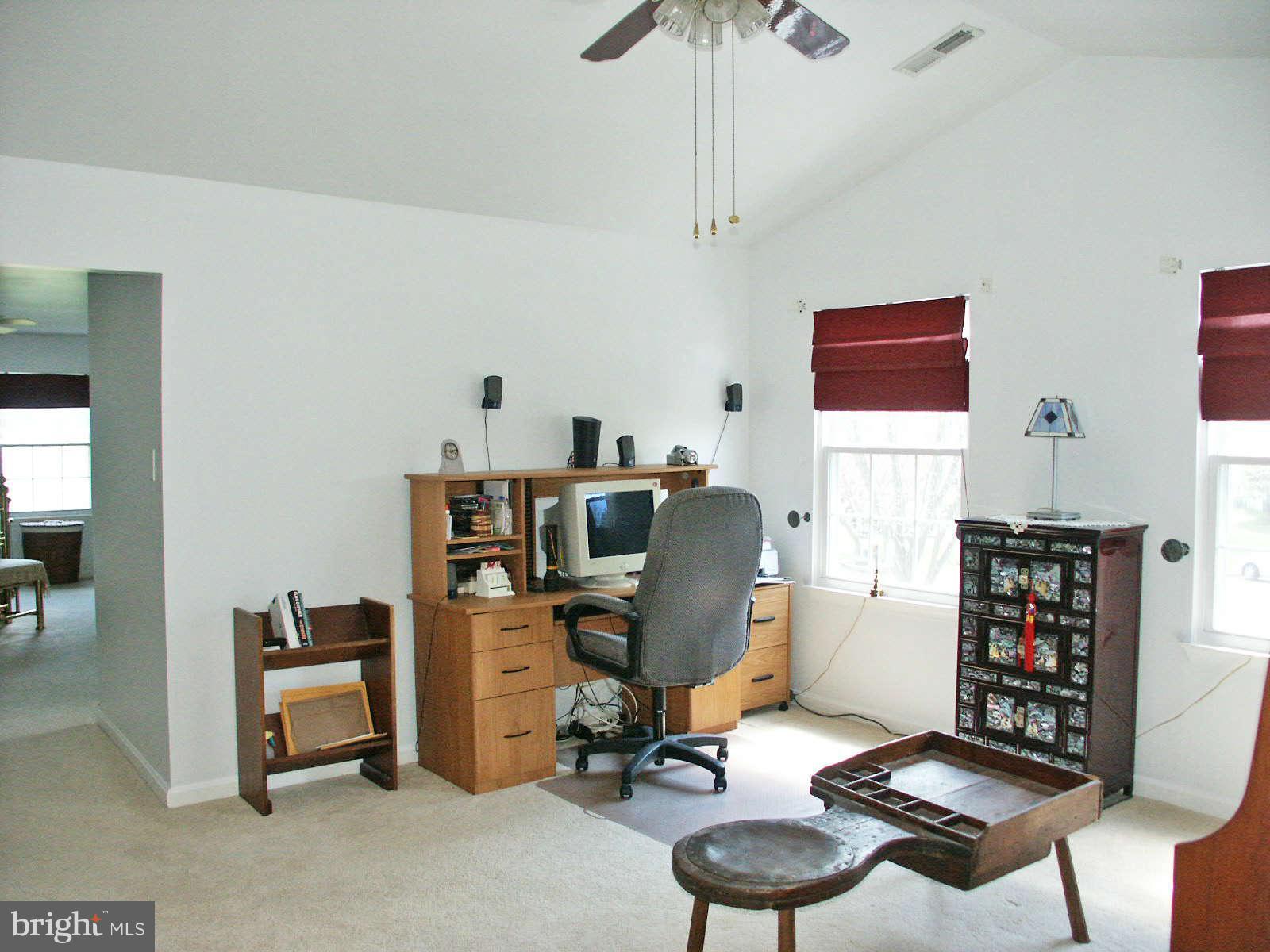 13868 Racine Court Woodbridge, VA 22193 - Photo 11 of 29 a view of a workspace with furniture and a window