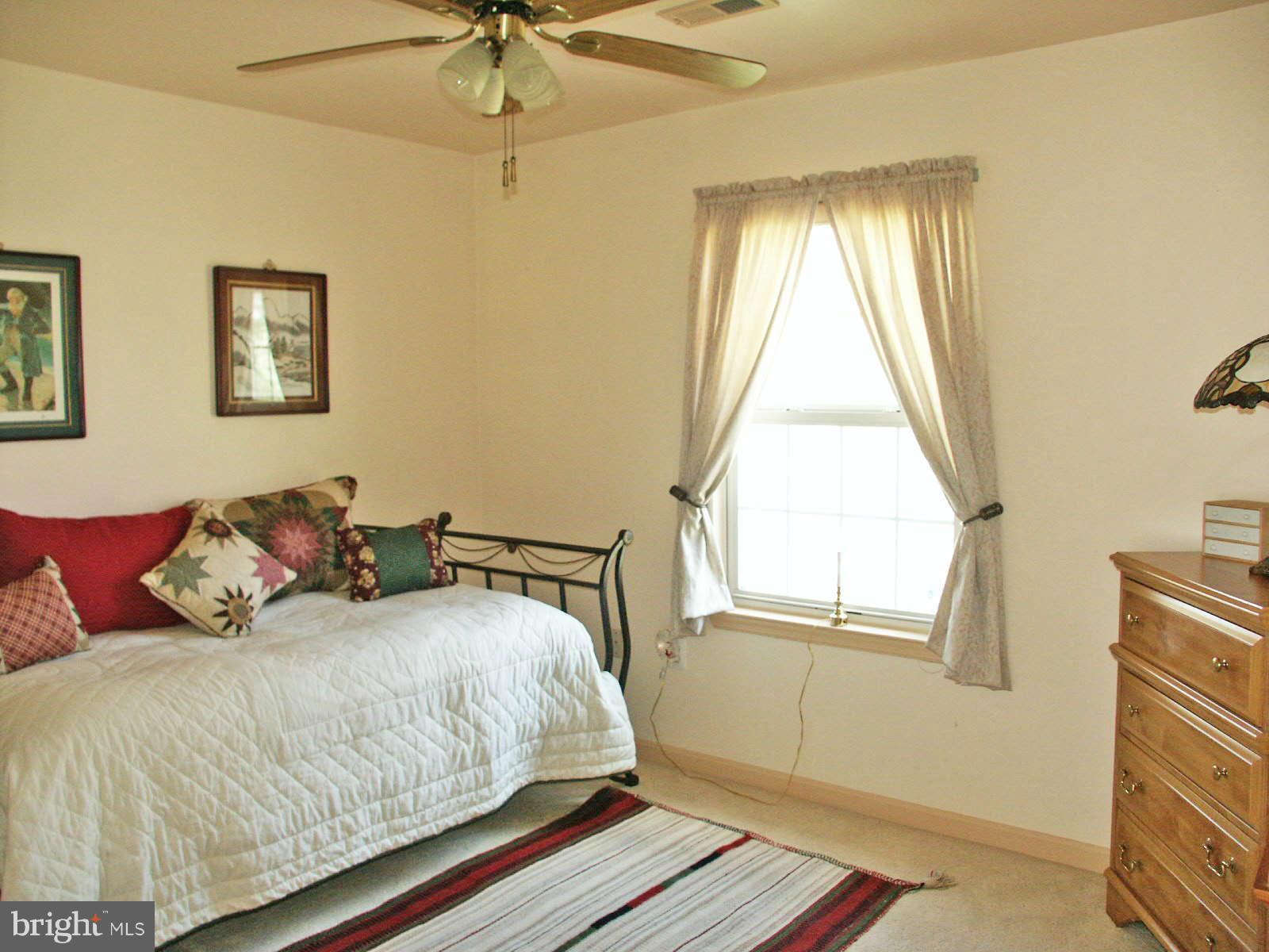 13868 Racine Court Woodbridge, VA 22193 - Photo 13 of 29 a bedroom with a bed and a window