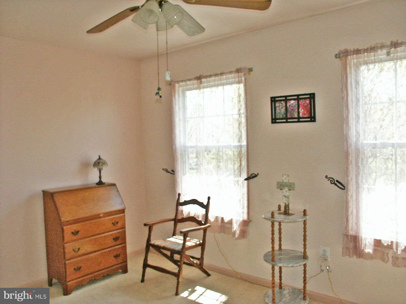 13868 Racine Court Woodbridge, VA 22193 - Photo 14 of 29 a room with furniture and two windows