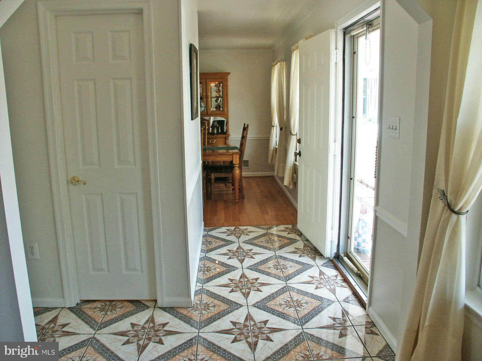 13868 Racine Court Woodbridge, VA 22193 - Photo 22 of 29 a view of a hallway with wooden floor and a bedroom