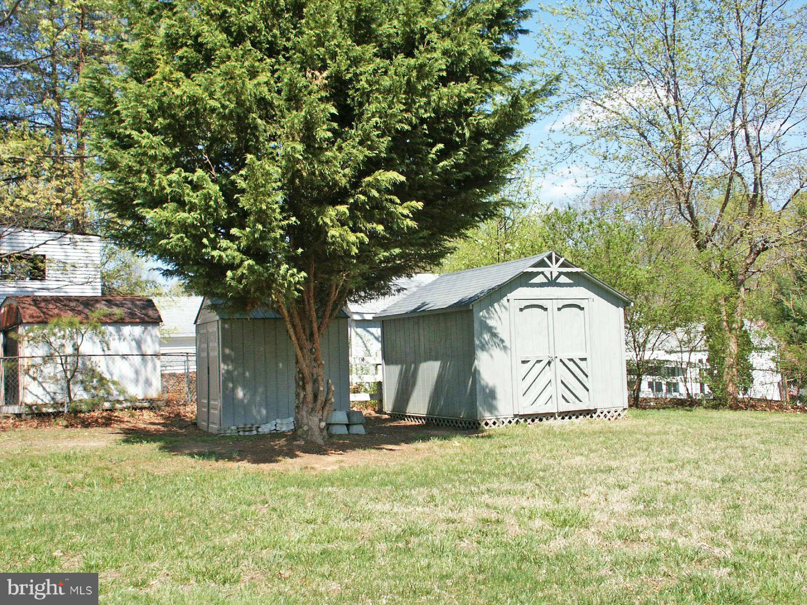 13868 Racine Court Woodbridge, VA 22193 - Photo 27 of 29 a view of a wooden house with a yard