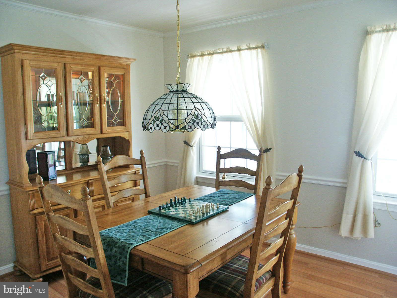 13868 Racine Court Woodbridge, VA 22193 - Photo 4 of 29 a view of a dining room with furniture window and wooden floor