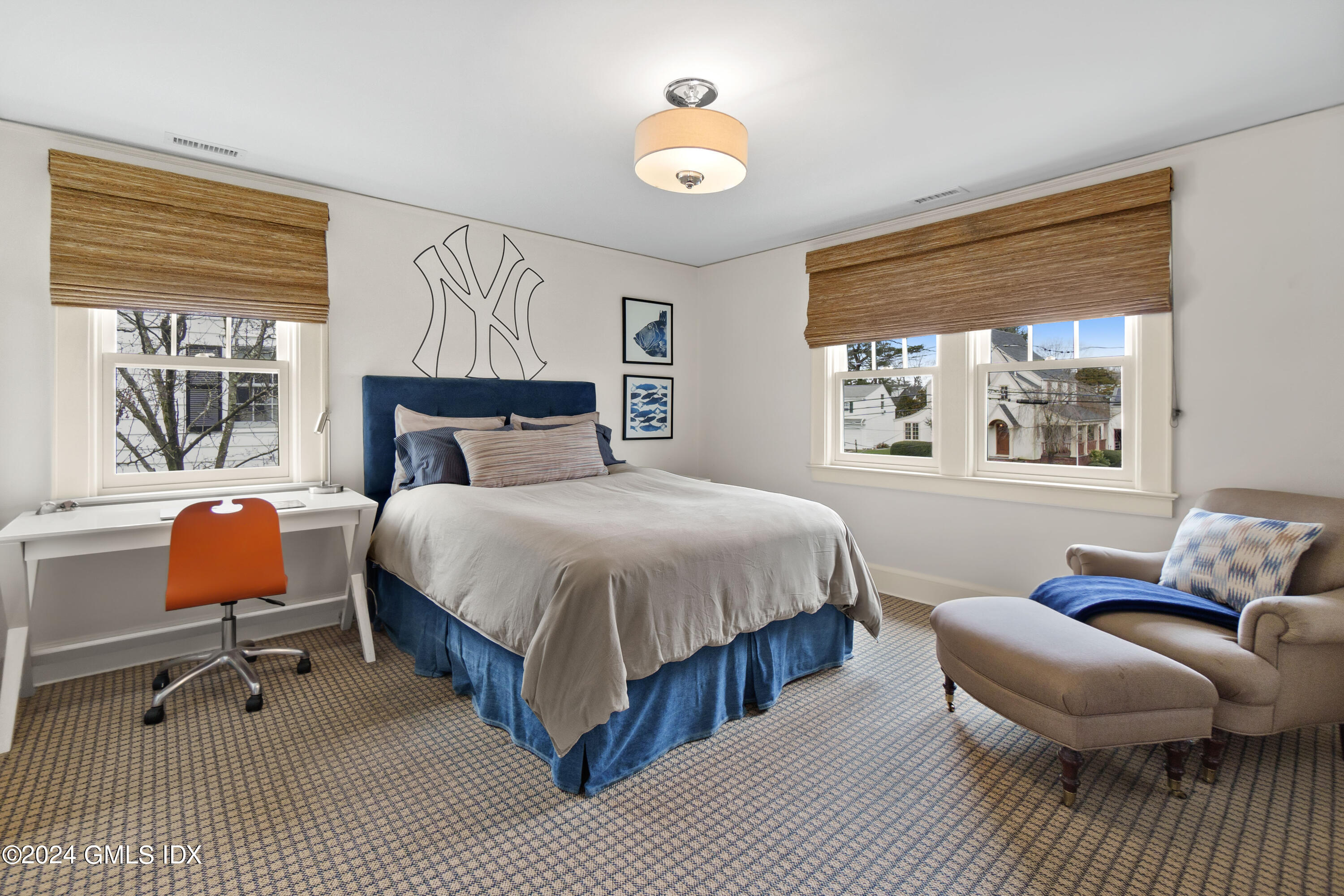 20 Knoll Street Riverside, CT 06878 - Photo 16 of 27 a bedroom with a bed and wooden floor