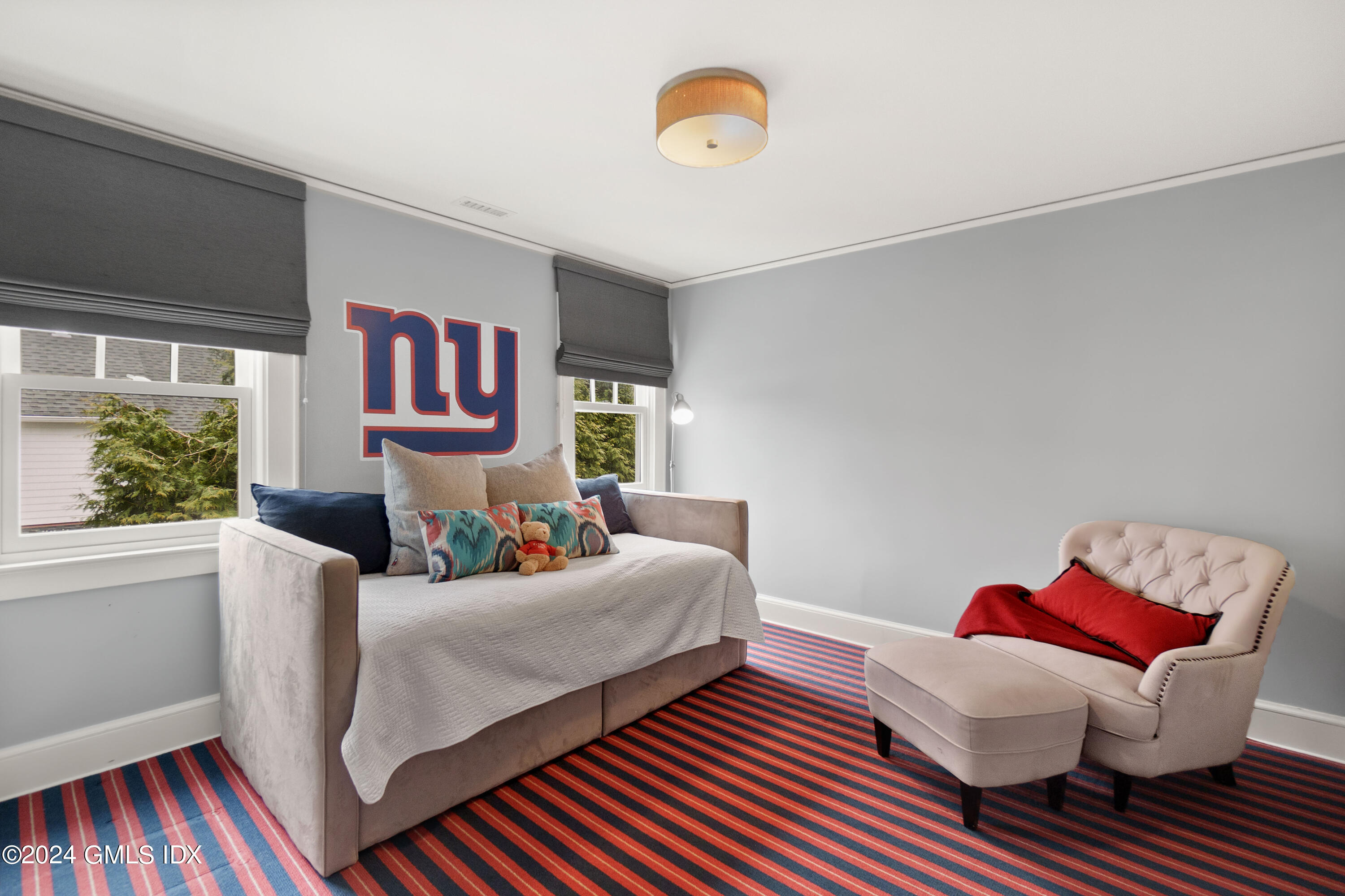 20 Knoll Street Riverside, CT 06878 - Photo 17 of 27 a bedroom with furniture and a window