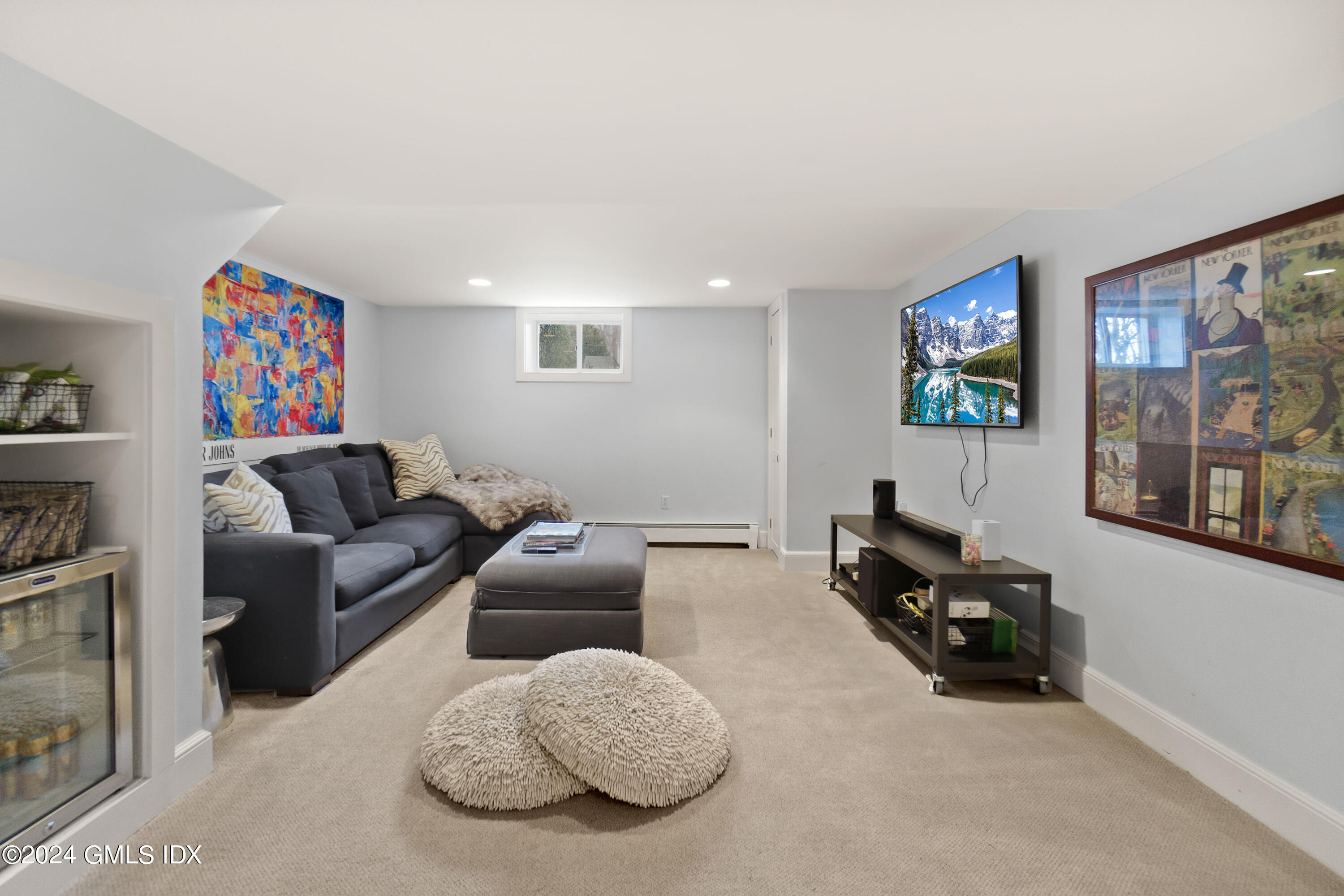 20 Knoll Street Riverside, CT 06878 - Photo 19 of 27 a living room with furniture and a flat screen tv